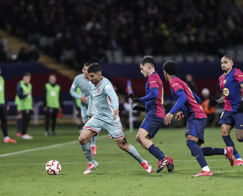 Angel Correa of Atletico de Madrid and Pedro Gonzalez Pedri of FC Barcelona